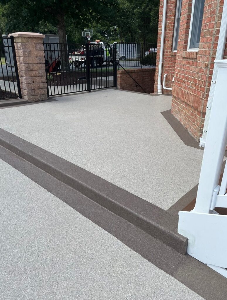 Textured patio surface with a brown border by Adams Property Works in Great Mills, MD