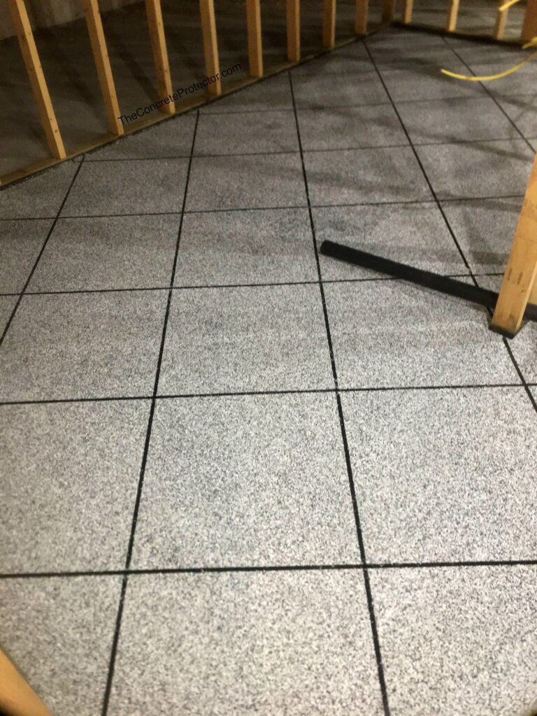 Epoxy Tile Flake Flooring, a coating system offered by Artisan Concrete Coatings in Jenkins, MN