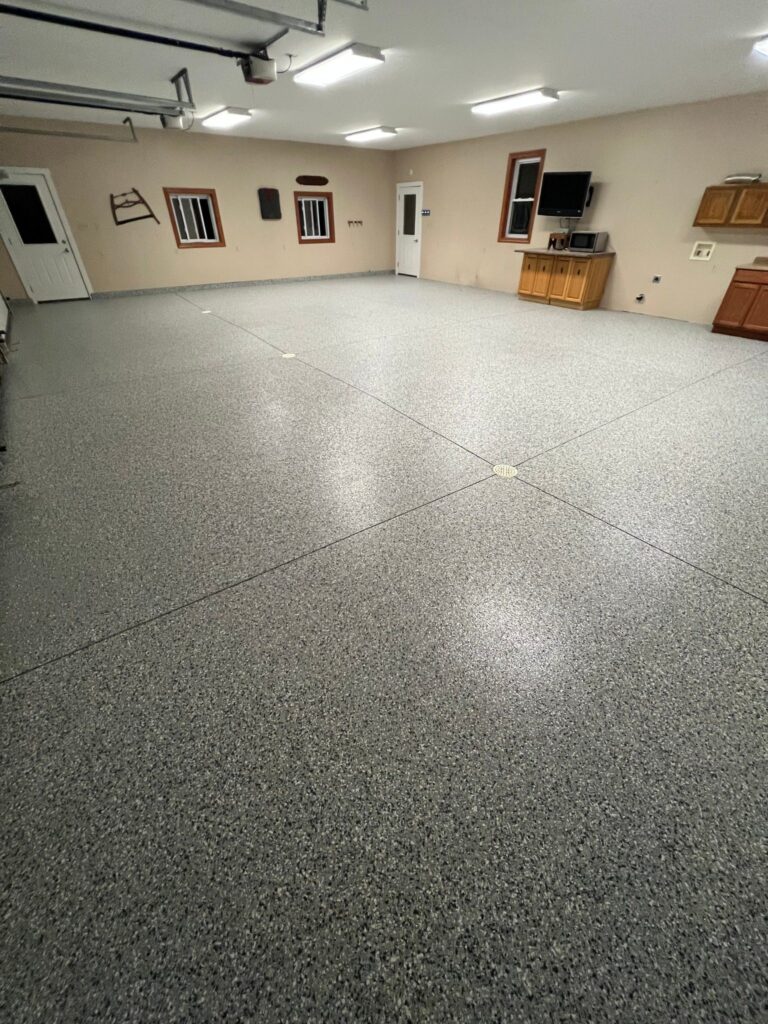 Example of a finished flake epoxy concrete floor coating in Seattle, WA – Ace Concrete Finishing, Inc.