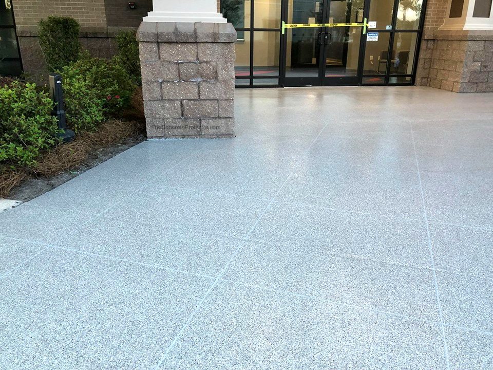 Example of a finished flake epoxy concrete floor coating in Elgin, IL