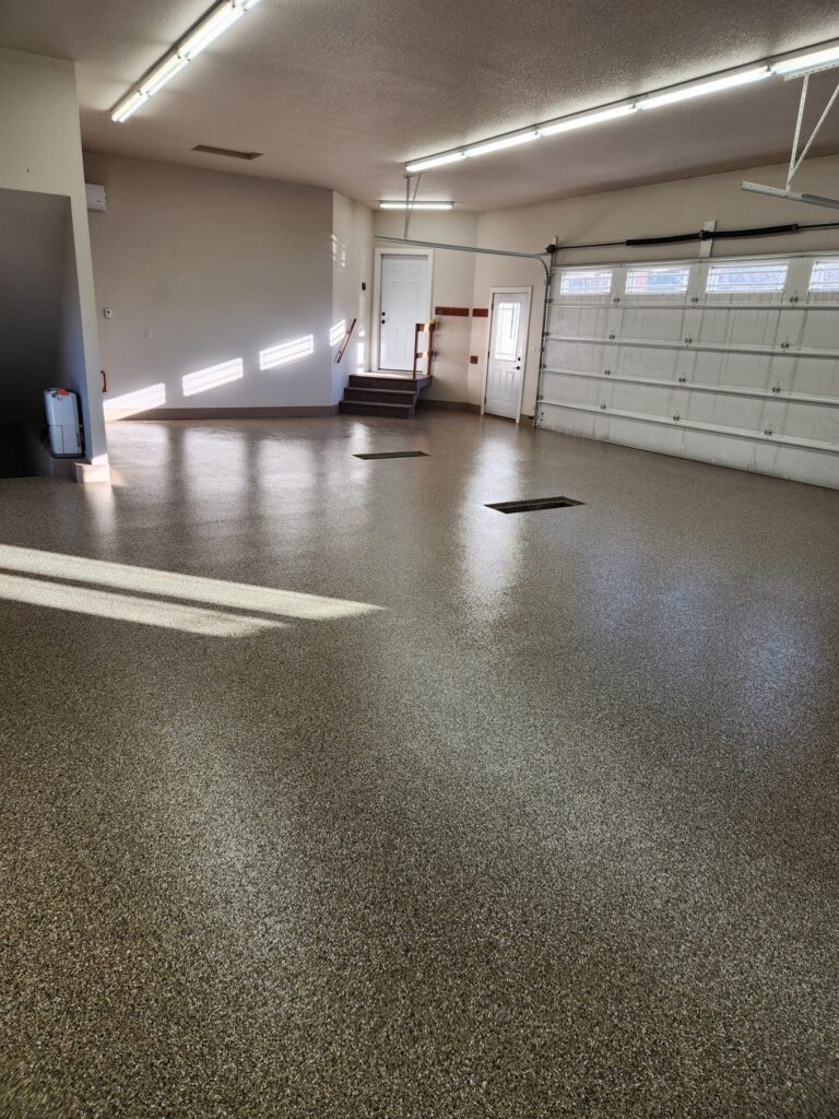 Example of a finished flake epoxy concrete floor coating in Hampton, VA – C & L Randolph Concrete LLC