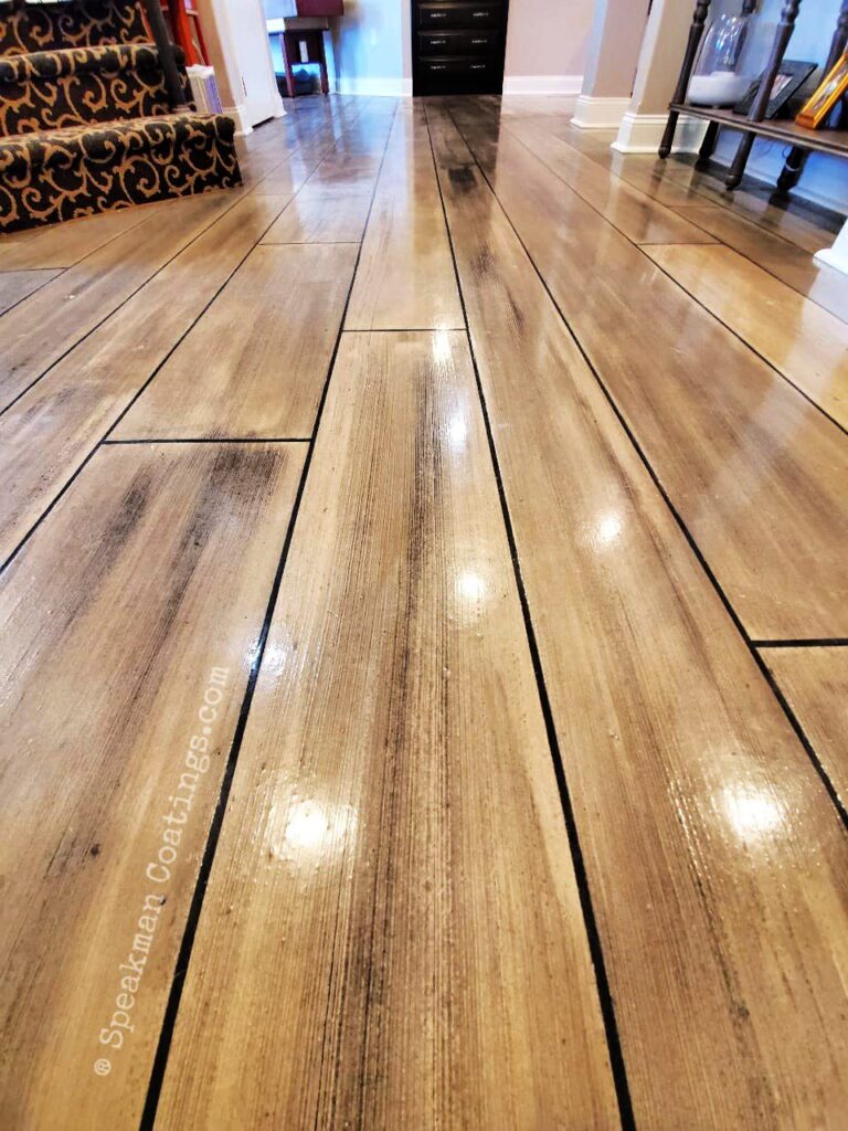 Example of a finished wood-look decorative concrete floor in Searcy, AR – AR Concrete Stains