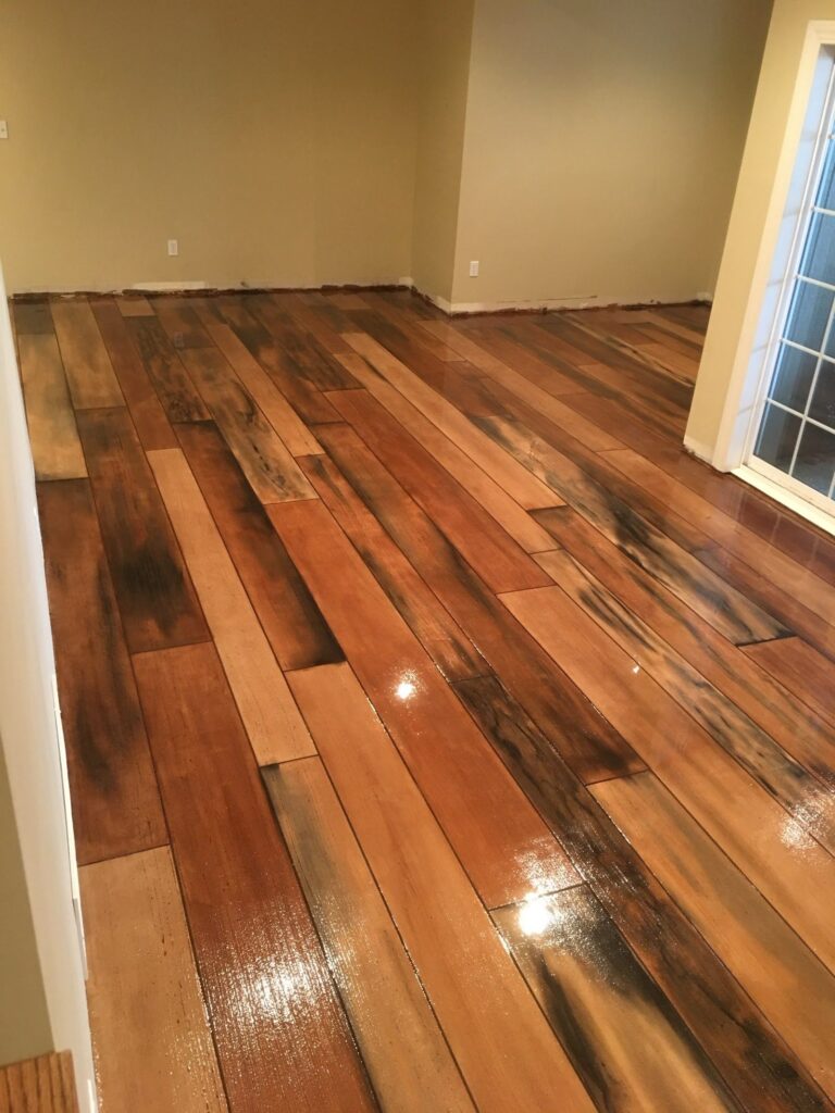 Example of a finished wood-look decorative concrete floor in Boston, MA – Garage Craftors