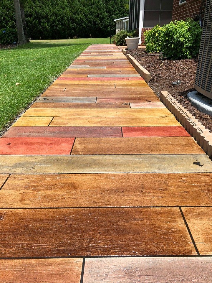 Example of a finished wood-look decorative concrete floor in Pine, CO – Mile High Epoxy Solutions, LLC