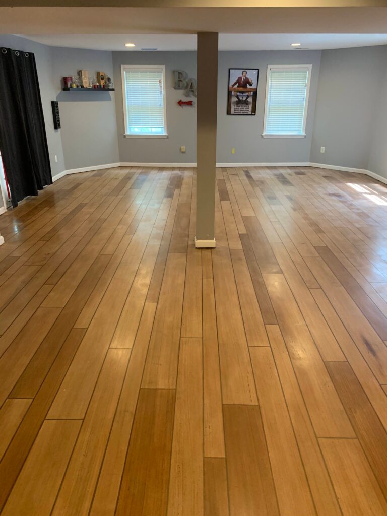 Example of a finished wood-look decorative concrete floor in Norfolk, VA – Concrete Virginia Beach