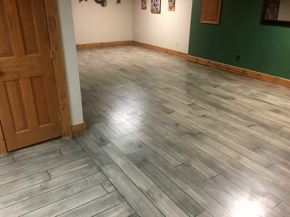 Example of a finished wood-look decorative concrete floor in New Braunfels, TX