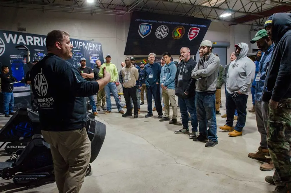 Contractor practicing a decorative concrete coating during hands-on training