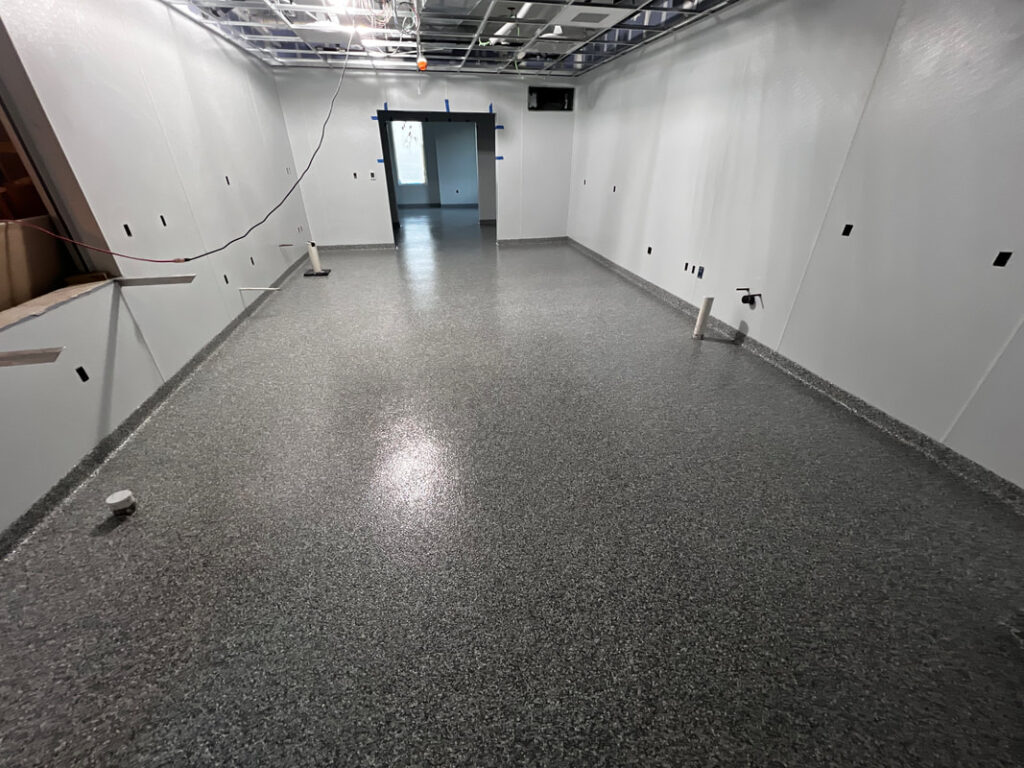 Epoxy flake floor with 4 inch integrated cove base by Harrisonburg Epoxy Flooring in Harrisonburg, VA